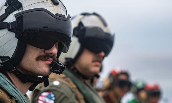 A naval aviator on the flight deck of the aircraft carrier USS Nimitz (CVN-68). 