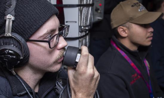 A fire-control technician passes information during a Mk 48 torpedo firing exercise on board the USS Chicago (SSN-721).  