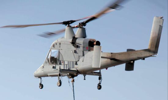 A K-MAX Cargo Unmanned Air System conducts a stable hover at Camp Dwyer in Helmand Province, Afghanistan