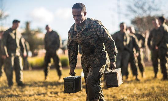 A Marine sprints with two ammo cans during the maneuver-under-fire portion of the combat fitness test, which complements the Marine Corps physical fitness test. A growing body of research shows a strong correlation between physical fitness and cognitive acuity. Exercise protects and creates new brain cells and activates the learning process, which is essential to outthinking and outsmarting adversaries.