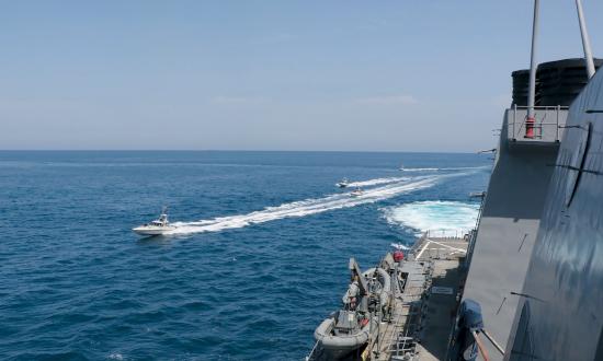 Iranian Revolutionary Guard Corps–Navy small boats harass the guided-missile destroyer USS Paul Hamilton (DDG-60) at close range in the Northern Arabian Gulf in April 2020. While deployed to the Fifth Fleet area of responsibility, Navy ships and U.S. Air Force squadrons need more opportunities to conduct joint unit-level training for air operations in maritime surface warfare to counter this threat.