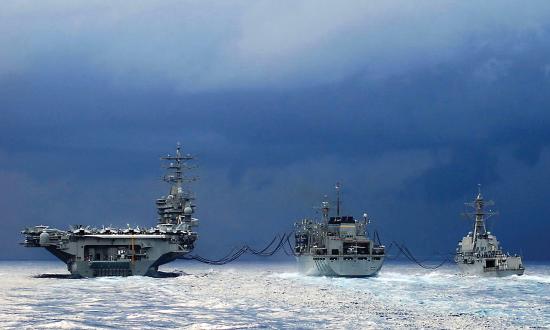 USNS Arctic (T-AOE 8) conducts an early morning Replenishment at Sea with USS Dwight D. Eisenhower (CVN-69) and USS Anzio (CG-68).