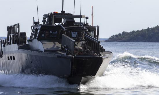 U.S. Marines approach a landing area in a CB-90 during Exercise Archipelago Endeavor with the Swedish Armed Forces in 2021. The Navy and Marine Corps should consider procuring and employing the Swedish Combat Boat 90 (CB-90) or similar craft for amphibious operations as an integral component of the Navy–Marine Corps amphibious team.