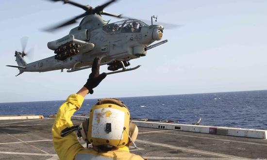 An AH-1Z Cobra helicopter attached to the 15th Marine Expeditionary Unit prepares to land on board the USS San Diego (LPD-22).