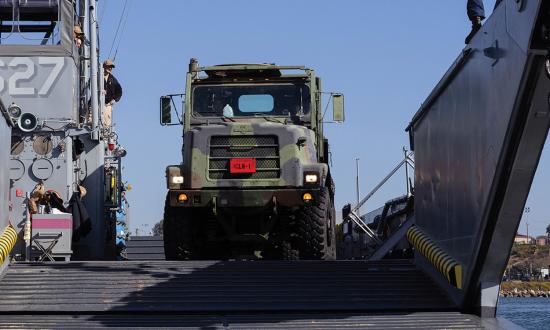 By working closely together, logisticians and intelligence personnel can determine the key adversary logistics nodes to attack and the U.S. logistics signatures to hide. Here,  U.S. Marines with Combat Logistics Regiment 1, 1st Marine Logistics Group offload a 7-ton truck from a landing craft, utility at Marine Corps Base Camp Pendleton, California. 