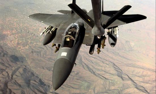A U.S. Air Force F-15E Strike Eagle refuels in-flight from a KC-135R Stratotanker in the skies over Macedonia on March 26, 1999