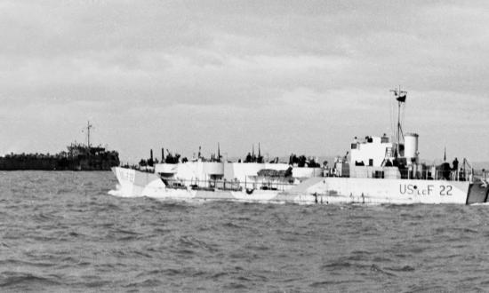 NAVAL HISTORY AND HERITAGE COMMAND  During rehearsals for the 1944 invasion of Europe, LCF-22, A British warship manned by a U.S. crew, stands offshore during a practice landing in England. (Note the USS LST-17 in the background.)