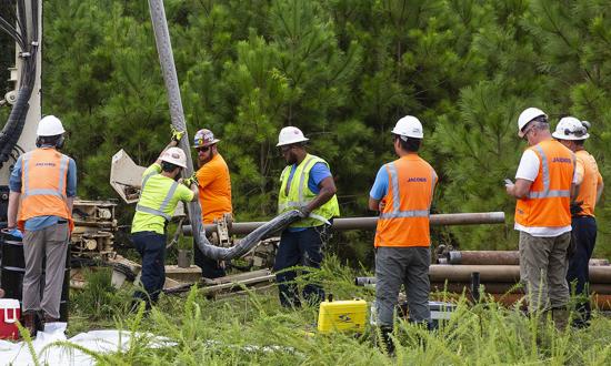 Navy contractors gather soil and groundwater samples for testing at Marine Corps Base Camp Lejeune, North Carolina. The Marine Corps instituted rigorous environmental tests after discovering the original water contamination, but the public is largely unaware of this.  