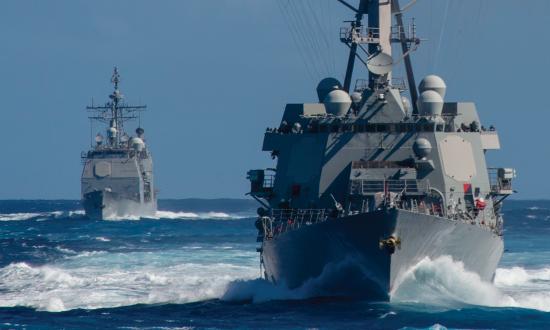 The USS Rafael Peralta (DDG-115), front, and the USS Bunker Hill  (CG-52) in the Pacific Ocean as part of the Theodore Roosevelt  Carrier Strike Group. 