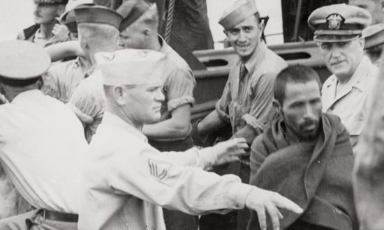 Japanese prisoners from the Battle of Leyte Gulf are brought aboard the USS New Jersey (BB-62) for questioning by Third Fleet intelligence officers, 24 October 1944. (For more on the New Jersey, see "Naval History News," p. 6.)