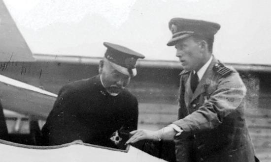 William Forbes-Sempill shows Japanese Admiral Heihachiro Togo the interior of a British-built Sparrowhawk fighter in 1921.