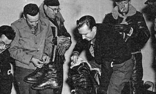 Future broadcast-news icon Walter Cronkite (center) and other American military journalists undergo flight training for bombing missions in 1943.