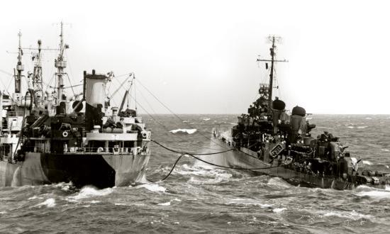 The Saumico-class fleet oiler USS Tallulah (AO-50) refueling an unnamed destroyer in the western Pacific in 1944.
