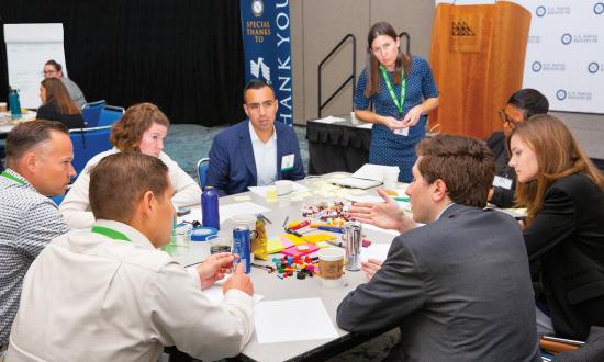 DARE participants are broken into groups and asked to brainstorm potential answers to two challenge questions posed by one of the Sea Service chiefs. 