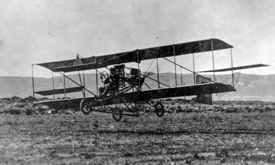 aerial front right view of the Curtiss A-1 Triad aircraft several feet off the ground