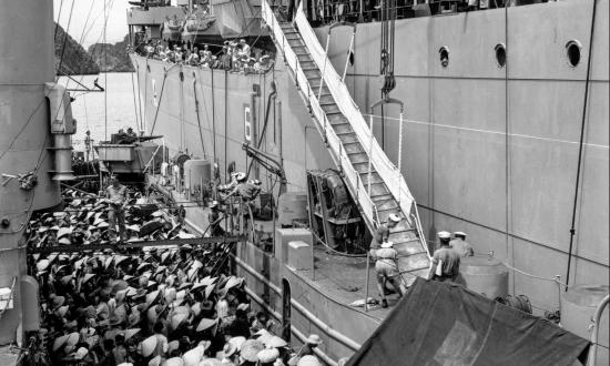 Voting with their Feet: Vietnamese refugees are transferred from a French ship to the USS Montague (AKA-98) during Operation Passage to Freedom.