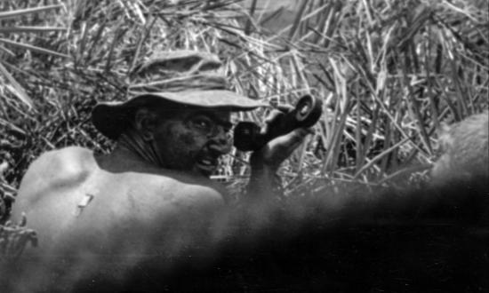 A Marine reconnaissance team leader calls air and artillery upon an unsuspecting enemy force.