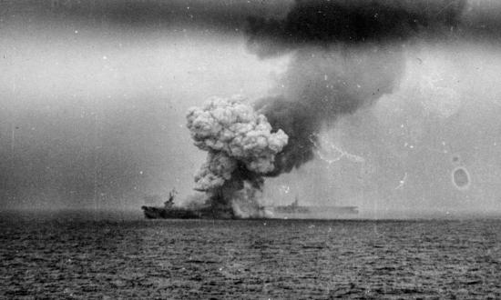 Smoke rising from the USS St. Lo after hits from a kamikazes