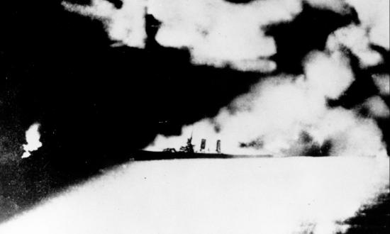 American cruiser caught in the searchlights of a Japanese ship during the Battle of Savo Island