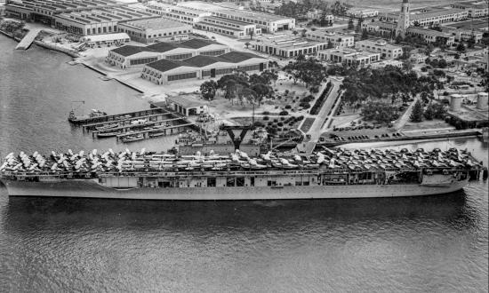 USS Yorktown (CV-5) docked at a pier at North Island, California, May 1940.