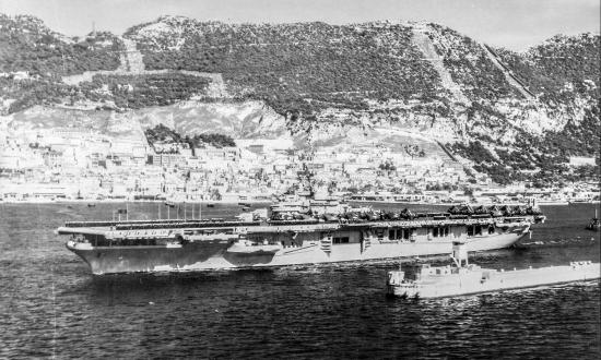 The USS Valley Forge (CV-45) steams out of the harbor at Gibraltar enroute to Bergen, Norway.