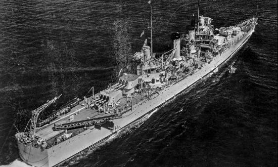 erial stern view of USS Honolulu (CL-48) underway at sea.