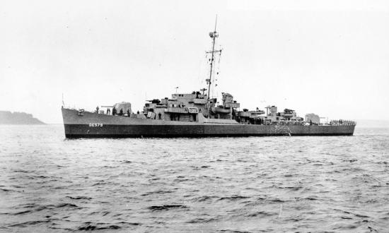 Surface port side view of the USS Riley (DE-579) at rest.