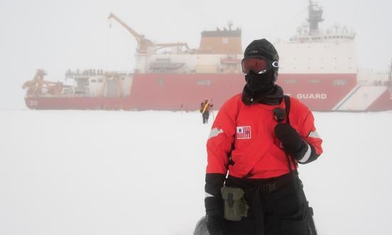  Petty Officer 1st Class Lisa Densmore stands polar bear guard outside the USCGC Healy (WAGB-20) on Sunday, Sept. 30, 2018 