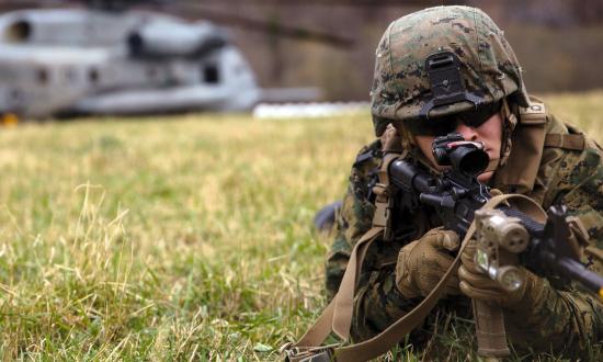 A Marine posts security after disembarking a CH-53E Super Stallion in Gjora, Norway during an air assault in support of Trident Juncture 18, Oct. 31, 2018