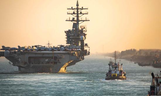The Nimitz-class aircraft carrier USS Dwight D. Eisenhower (CVN-69) transits the Suez Canal in November to the U.S. Fifth Fleet area of operations. 