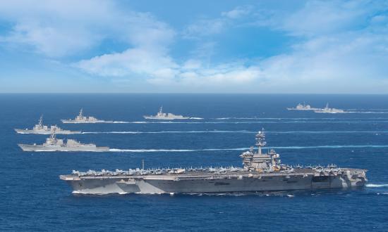 The USS Theodore Roosevelt carrier strike group transits in formation while deployed in the Indo-Pacific region in January 2020. By late March, the carrier would be in Guam battling an outbreak of the COVID-19 illness among the crew. 