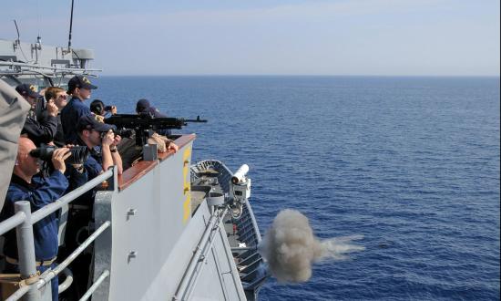Crew members on board the Ticonderoga-class guided-missile cruiser USS Monterey (CG-61) observe as the ship’s weapons department fires the MK-45 5-inch/54-caliber lightweight gun during a gunnery exercise