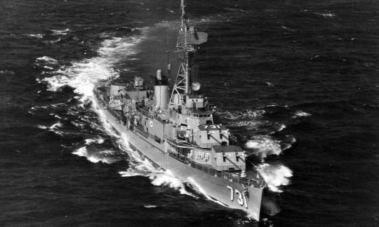 Aerial starboard bow view of the USS Maddox (DD-731) underway.