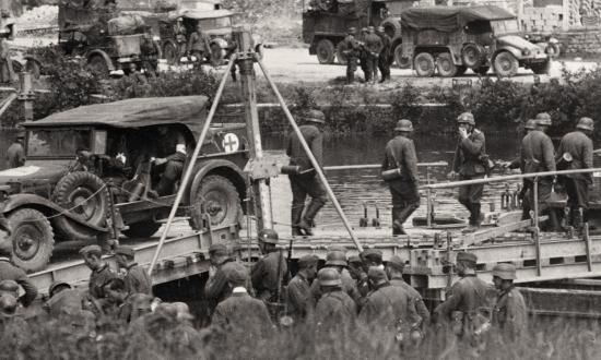 German troops crossing the Meuse near Sedan,  Ardennes, in May 1940. The Germans’ rapid advance was aided by corps and division commanders’ independent actions. XIX Panzer Corps commander General Heinz Guderian recalled he “made all decisions independently until we reached the Atlantic at Abbeville.”