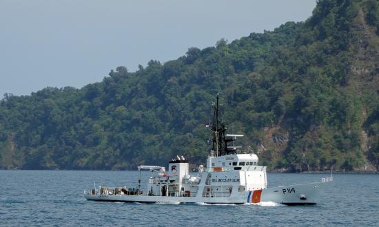 Indonesian Sea and Coast Guard ship KN Alugara passing the island of Rakata