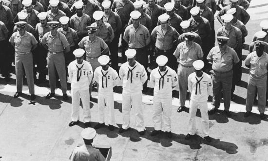 Republic of Vietnam. Vice Admiral Elmo R. Zumwalt, Jr., Commander, U.S. Naval Forces, Vietnam, Awards the Navy Unit Commendation to Crewmen of the Tank Landing Ship USS Harnett County (LST-821).
