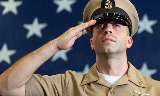 RED SEA (Sept. 13, 2019) Chief Aviation Electrician’s Mate Collin Peskett, assigned to amphibious assault ship USS Boxer (LHD 4), passes through the sideboys during the chief petty officer pinning ceremony in the hangar bay