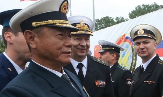 Chinese and Russian navy commanders greet each other