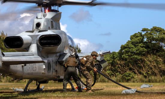 Marines refuel an AH-1Z Viper during a forward arming and refueling point (FARP) exercise. With properly cross-trained Marines, the Marine Corps has the expertise to deploy and sustain multiple FARPs across dispersed areas. 