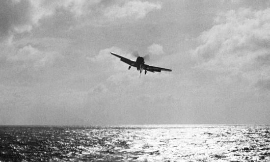 An F6F Hellcat comes in for a landing aboard the USS Intrepid (CV-11) after a strike on the Philippines in November 1944.