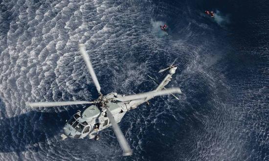 MH-60 helicopter naval air crewmen conduct a search-and-rescue drill while underway in the Atlantic Ocean. 