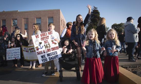 Family members await the return of the U.S. Coast Guard Cutter Stratton 