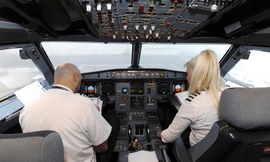 Air Serbia Airbus A319 Crew members captain Davor Miseljic and copilot Biljana Savic prepares for flight at Zagreb airport on December 12, 2014 in Zagreb