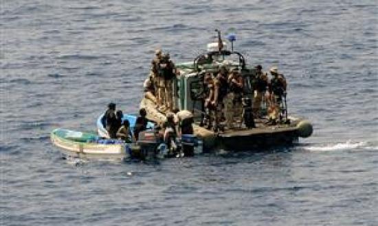 A visit, board, search, and seizure team from the USS Ashland (LSD-48) board and inspects two fishing skiffs for suspected pirate activity on 6 May. At some point soon, the author says, the United States must assess various courses of action to alleviate 