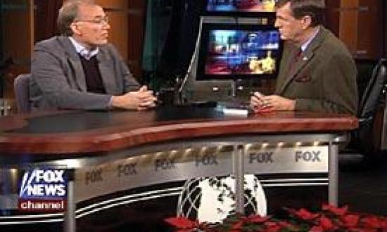 COURTESY OF THE FOX NEWS CHANNEL, "SPECIAL REPORT WITH BRIT HUME","Professor Hanson, left, appears on New Year's Day 2003 with Fox News Channel anchor Brit Hume.