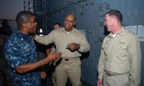 Providing honest feedback to all levels in the chain-of-command is a Chief's most important responsibility, the author says. Here, Rear Admiral Sinclair Harris (center), commander of Expeditionary Strike Group 5, speaks with Captain Kevin Couch, commandin